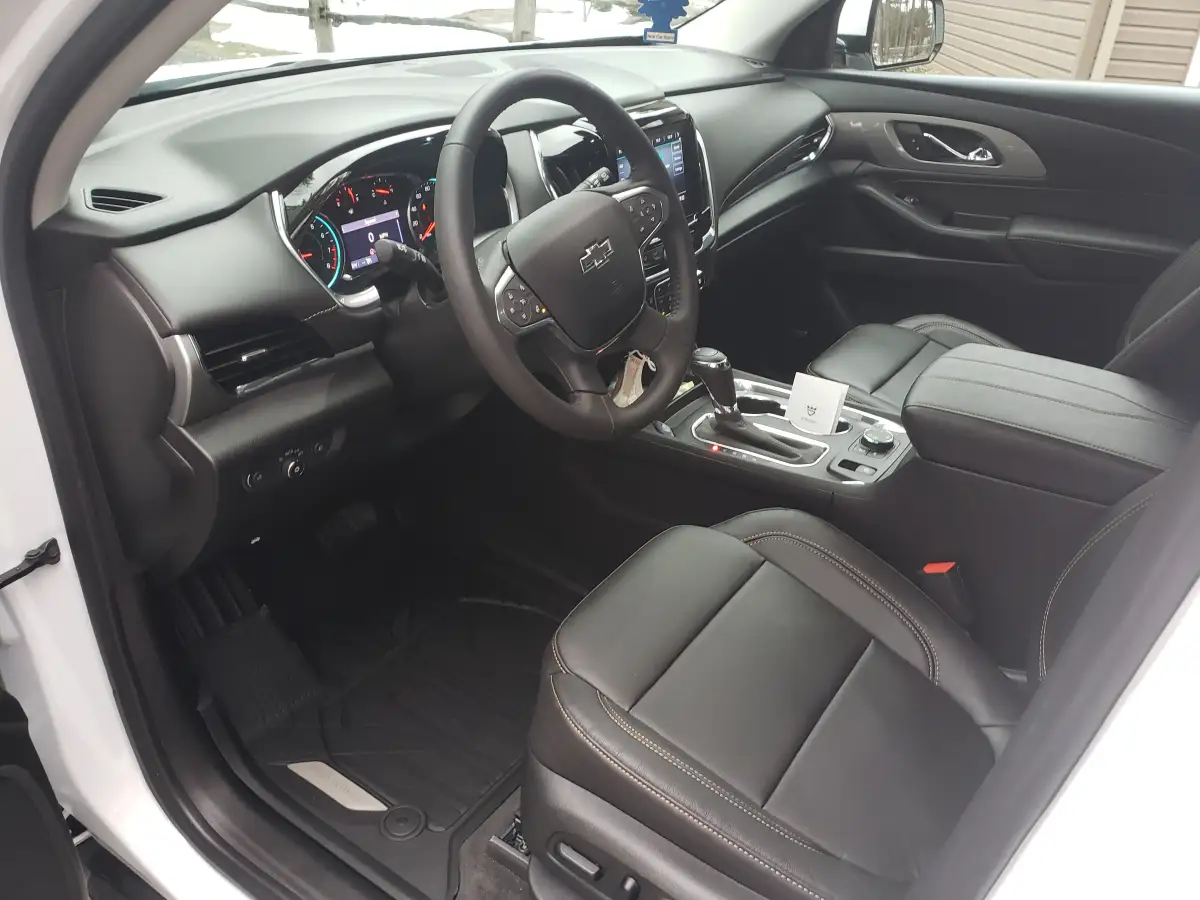 Clean black leather Chevrolet SUV interior showing dashboard, steering wheel, and center console