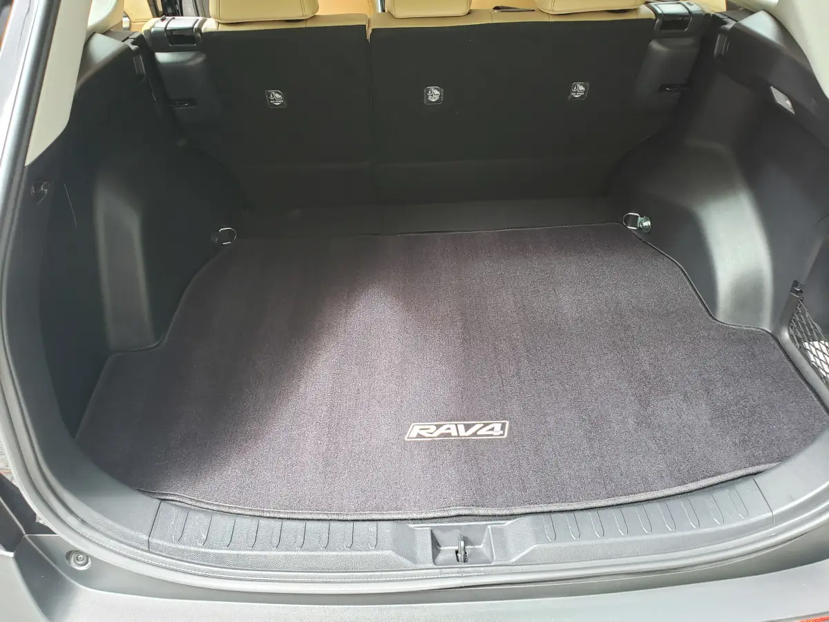 Clean cargo area and trunk liner of a black Toyota RAV4 SUV